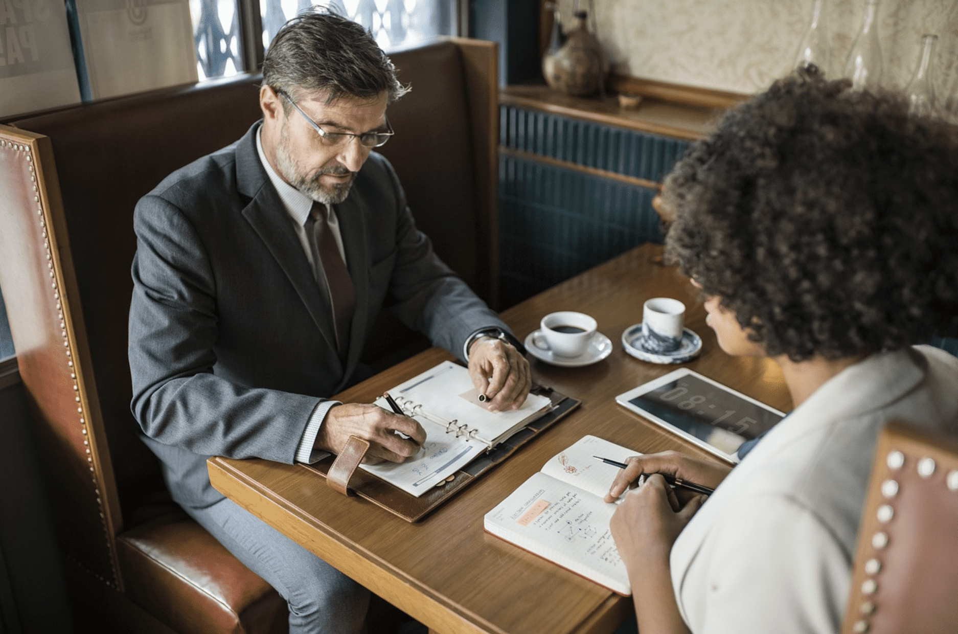 man talking to a woman during an interview